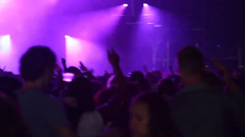 Insane crowd - Hands in the air - Facing stage - Lightshow - Lensflares - Fes Stock Footage 34135799