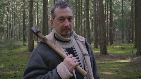 Insane forest maniac with ax Stock Footage 73790696