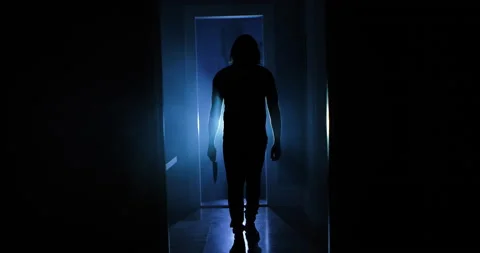 Insane Serial Killer w/ Knife Waking Down Old Hallway Slow Motion 4k Video stock 161593675