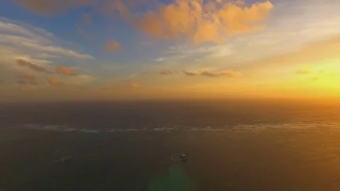 Insane view of the boundless ocean in the rays of the setting sun, aerial Stock Footage 72150676