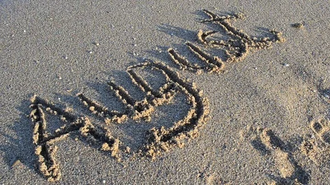 Inscription August on sand. The inscription is washed away by a sea wave. Stock Footage