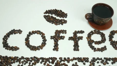 Inscription coffee beans on the table Stock Footage 108611196