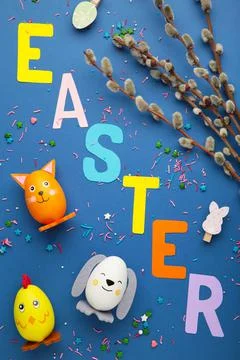 Inscription Easter on blue background, a rope with clothespins. The concept o Stock Photos