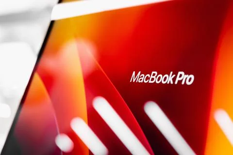 The inscription on the Macbook Pro monoblock computer with Apple's branded Stock Photos