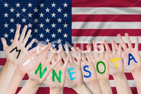 Inscription Minnesota on the children's hands against the background of a wav Stock Photos