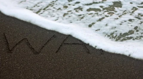 The inscription on the sand of "War" Stock Footage 62437708