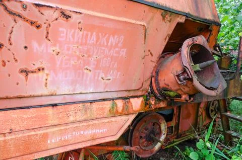 Inscription with socialist commitment on abandoned combine harvester Fotos de archivo