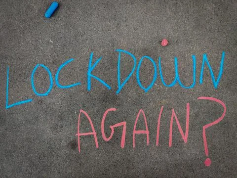 The inscription text on the grey board, Lockdown again with question mark Usi Stock Photos