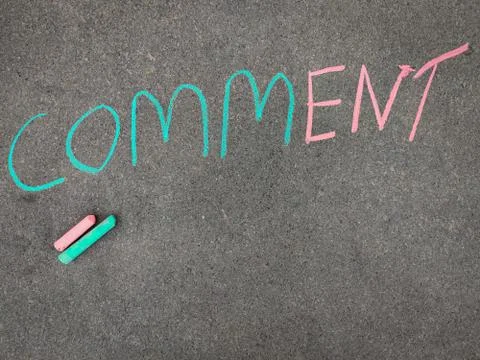 The inscription text on the grey board,COMMENT. Using color chalk pieces. Stock Photos