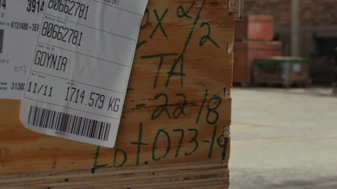 Inscriptions on wooden box in warehouse of customs service in port Stock Footage 92405341