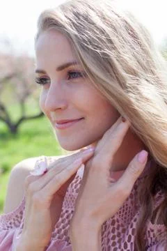 Insect ladybug on a blonde woman's hand Foto stock