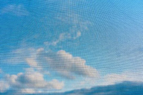 Insect screen against the sky. Background, texture Stock Photos
