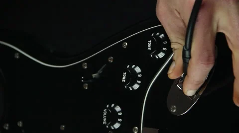 Inser guitar jack close up Stock Footage 45308193