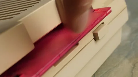 Insert ancient 3.5 inch  floppy disk in retro personal computer 4K 2160p 30fp Stock Footage 56240497