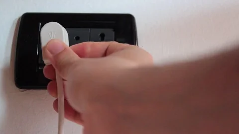 Insert an antenna cable into the household power socket Video stock 76165616