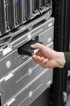 Insert backup tape Stock Photos