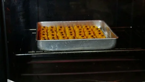 Insert the biscuit into the oven, bottom heating bar red smoldering Stock Footage 111884746