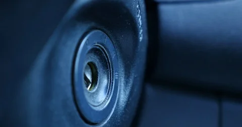 Insert car key into ignition - extreme close up Stock Footage 128663050