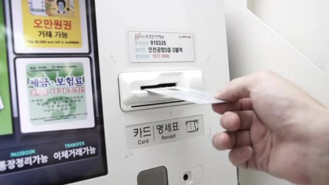Insert a card into an ATM machine Stock Footage 139750952