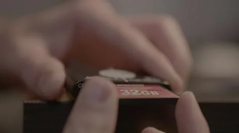 Insert CF card into reader, slow motion Stock Footage 56778019
