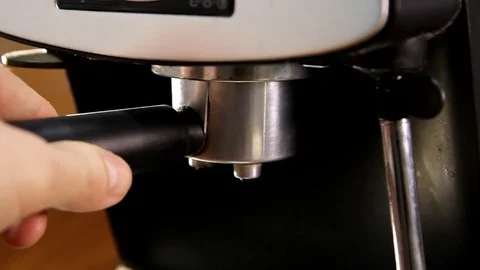 Insert coffee horn into a coffee machine, close-up Stock Footage 83273900