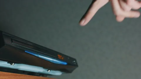 Insert A Disc Into A DVD Player  Stock Footage 58424992