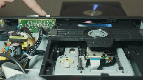 Insert A Disc Into A DVD Player  Stock Footage 58425452