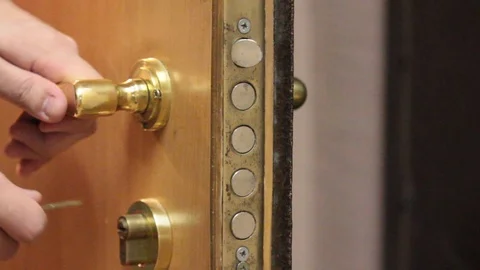 Insert the key into the lock Stock Footage 97715100