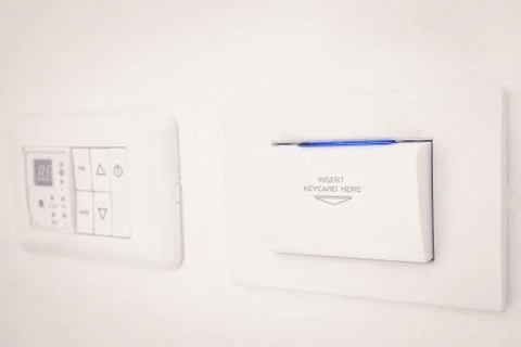 Insert keycard sign electronic lock on wall for open switch electronic Stock Photos