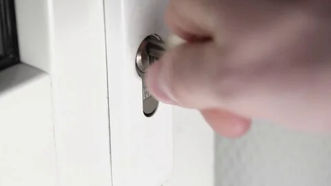 Insert keys in the door lock Stock Footage 84151943