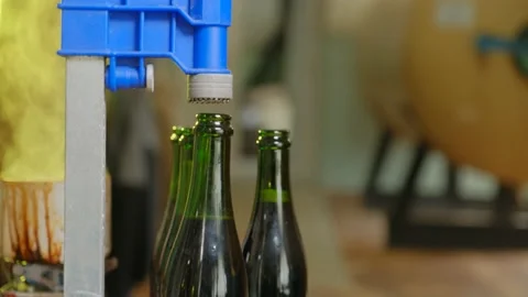 Insert the lid. then the beer bottle is capped Stock Footage 185896450