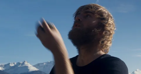 Insert of man juggling rocks in nature Stock Footage 90405047