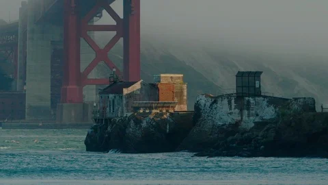Insert: Old outpost on rock outcropping is nestled under Golden Gate Bridge 스톡 동영상 94045642