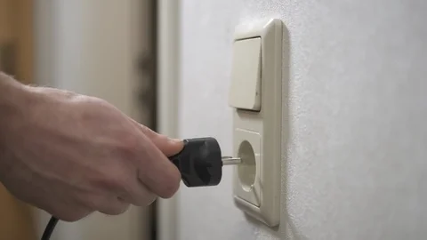Insert a plug Stock Footage 123379359