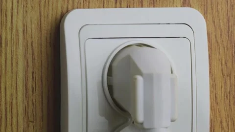 Insert the plug into the outlet Stock Footage 246809102