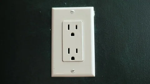 Insert the plug into the socket. US type Stock Footage 70862189