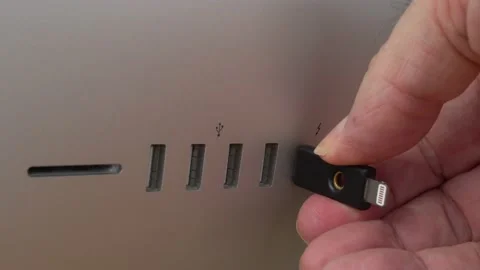 Insert security hardware key for authentication in Computer Stock Footage 137839295