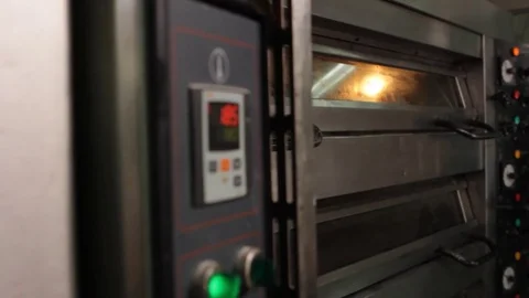 Insert tray into oven Stock Footage 77046354