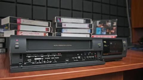 Insert VHS Cassette into VCR and Push Play Button Stock Footage 172351495