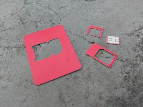 Inserted SIM card and red SIM card with frames of various sizes. Stock Photos