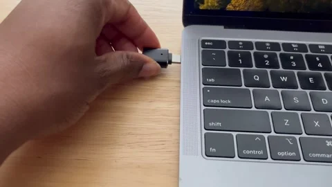 Inserting a 3.0 USB adapter to USB-C adapter into a laptop Vídeo Stock 259237747