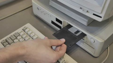 The Inserting 3.5 And 5.25 Inch Floppy Disks. Old-style Computer 스톡 동영상 157960969