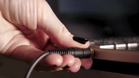 Inserting A 3.5mm Headphone Jack Stock Footage 132159024