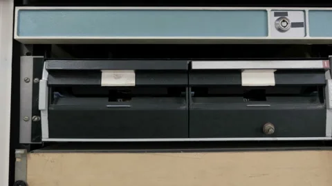 The Inserting 8 Inch Floppy Disk. Old-Style Computer Stock Footage 105466451