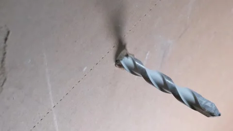 Inserting anchors through a drywall. Stock Footage 340449510