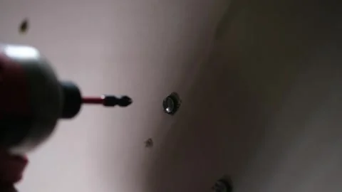 Inserting anchors through a drywall. Stock Footage 340449525