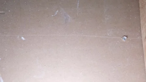 Inserting anchors through a drywall. Stock Footage 340449532