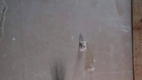 Inserting anchors through a drywall. Stock Footage 340449576