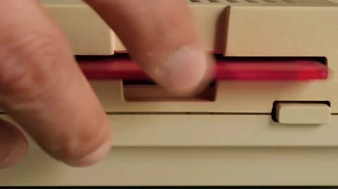 Inserting ancient floppy disk in personal computer 4K 3840X2160 UltraHD foota Stock Footage 52452665