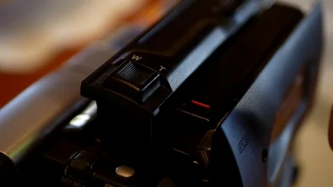 Inserting and ejecting a cassette into a camcorder Stock Footage 84767374